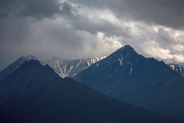 Overcast in mountains. Beautiful mountain rocks in clouds. Landscape of the North Caucasus