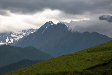 Overcast in mountains. Beautiful mountain rocks in clouds. Landscape of the North Caucasus
