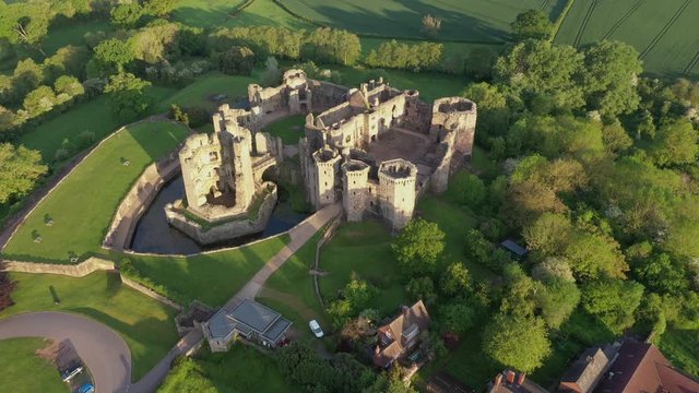 4K aerial dawn footage of Raglan castle, a late medieval castle located in the county of Monmouthshire in South Wales.