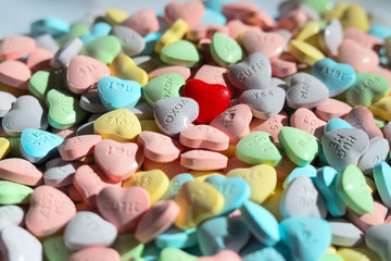 colorful hearts piled with one red heart