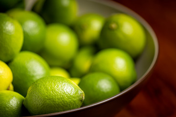fresh green limes in a bowl