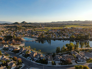 Aerial view of Menifee Lake and neighborhood, residential subdivision vila during sunset. Riverside County, California, United States