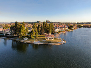 Aerial view of Menifee Lake and neighborhood, residential subdivision vila during sunset. Riverside County, California, United States