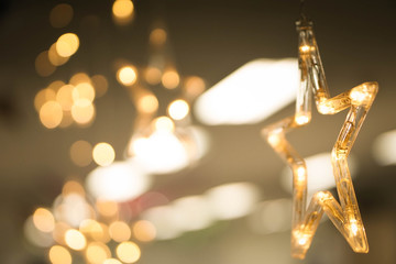 Golden star and light blur background.