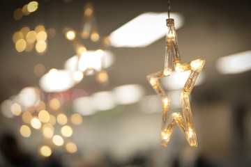 Golden star and light blur background.