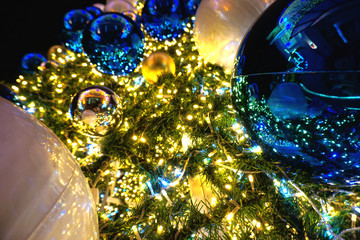 Blue and white buable decoration on Christmas tree, copy space.