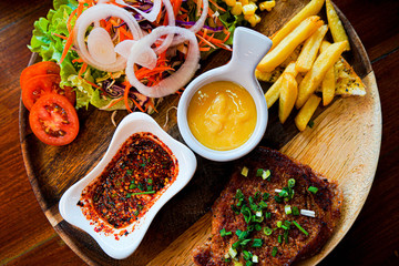 beautiful steak with salad and Mayonnaise and chili