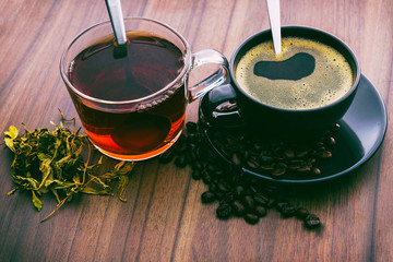 Hot coffee and hot tea on the wooden floor