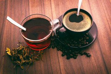 Hot coffee and hot tea on the wooden floor