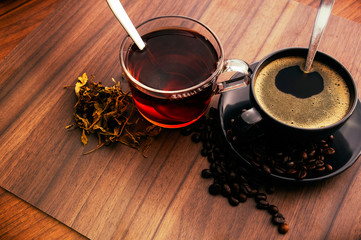 Hot coffee and hot tea on the wooden floor