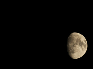 moon in the black sky. three fourth rounds.