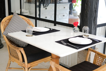 table & wicker rattan chair in cafe restaurant