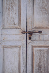 old vintage wooden door and retro metal locking handle lock