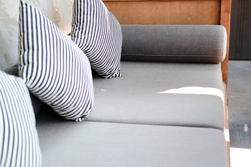 blue white stripe pillow on sofa couch in living room