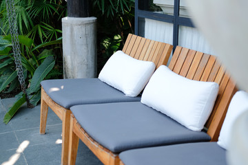 pillow cushion on wooden chair in hotel resort for relaxing outdoor