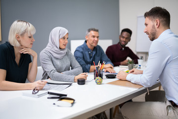 Man Sitting At Interview