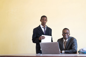   African ethnicity business people studying together as a technology symbol