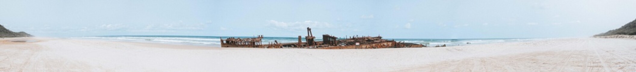 Fototapeta na wymiar Shipwreck On The Beach – Panorama