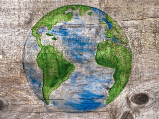 Earth Day. Beautiful greeting card. Isolated background, close-up, view from above, wooden surface. Congratulations for relatives, friends and colleagues