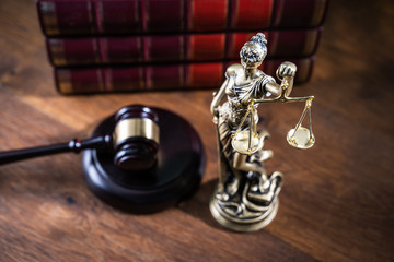 Gavel On Book With Golden Scale
