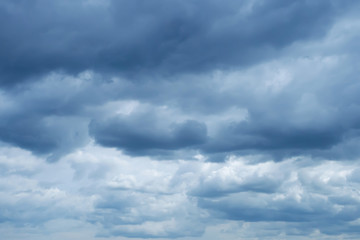 blue sky with soft Cumulus dark blue clouds