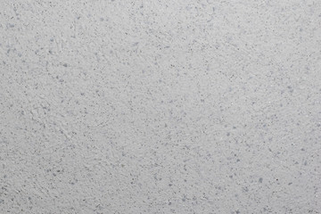 The wall is covered with beautiful textured plaster with sequins.