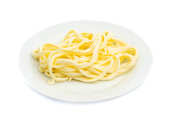 smoked white cheese with fibers and stripes on a white plate isolated