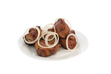 Skewers in large pieces of pork meat with onions on a white plate isolated
