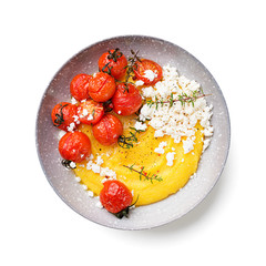 Homemade polenta with grilled cherry tomatoes and ricotta cheese. isolated on white background