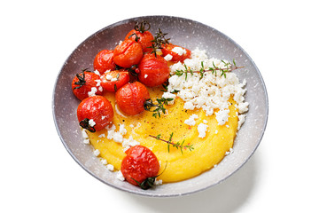 Homemade polenta with grilled cherry tomatoes and ricotta cheese. isolated on white background