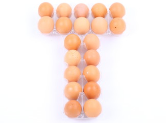 Tray of raw eggs isolated on a white background