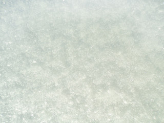 The texture of the snow in the winter. Snow close-up view from above.