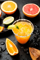 Refreshing summer alcoholic cocktail margarita with crushed ice and citrus fruits.