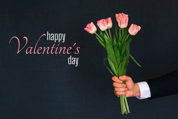 Greeting card with the inscription Happy Valentine's Day. Bouquet of pink Tulip flowers