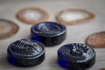 Isolated close up natural table background of blue glass, stones and crystals 