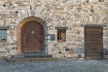 An ancient building with wooden doors.