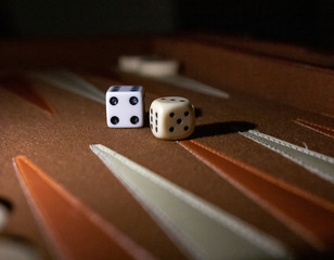 Dramatic close up of backgammon board and pair of dice
