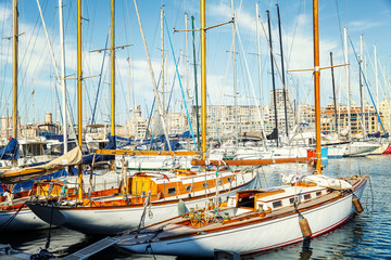 Beautiful snow-white sailing yachts in the old port of Marseille on a sunny day. Close-up.