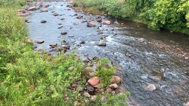 Real time lockdown shot of stream with water flowing
