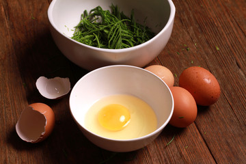 egg and acacia pennata for omelet cooking, Thai cuisine - calls that cha-om omelet