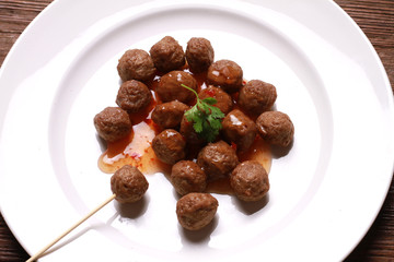 fried meat ball and sauce on white dish