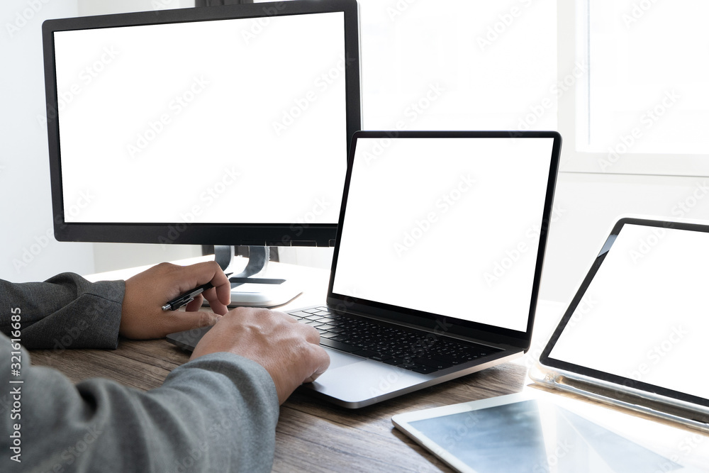 Poster man of business man hand working on laptop computer on wooden desk laptop with blank screen on table