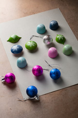 Christmas decorations and luxury candies on gray paper