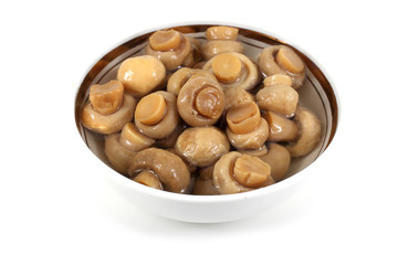 Little champignon mushrooms in saucer