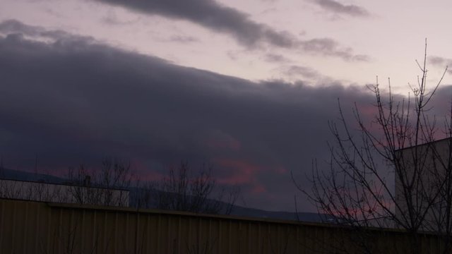 Time lapse of a scary cloudy purple sunset.