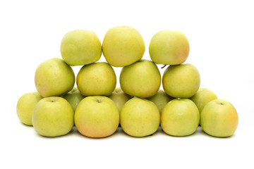 group of yellow apples on a white background, live vitamins, natural iron in fruits