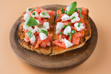 Italian bruschetta with tomatoes, mozzarella cheese and basil