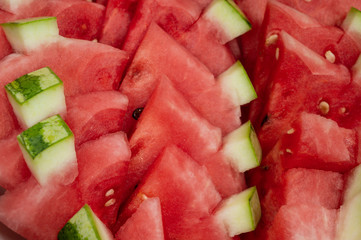 Close up and top view pieces of sliced watermelon. Red fresh fruit for drinking juice menu.