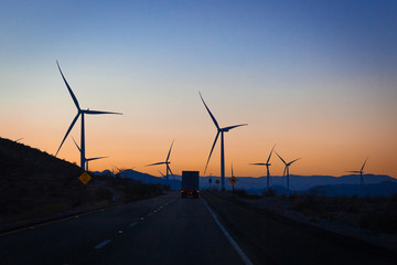 wind turbines at sunset