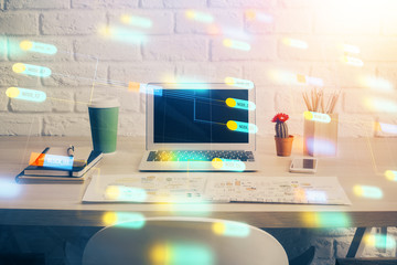 Double exposure of desktop computer and technology theme hologram. Concept of software development.